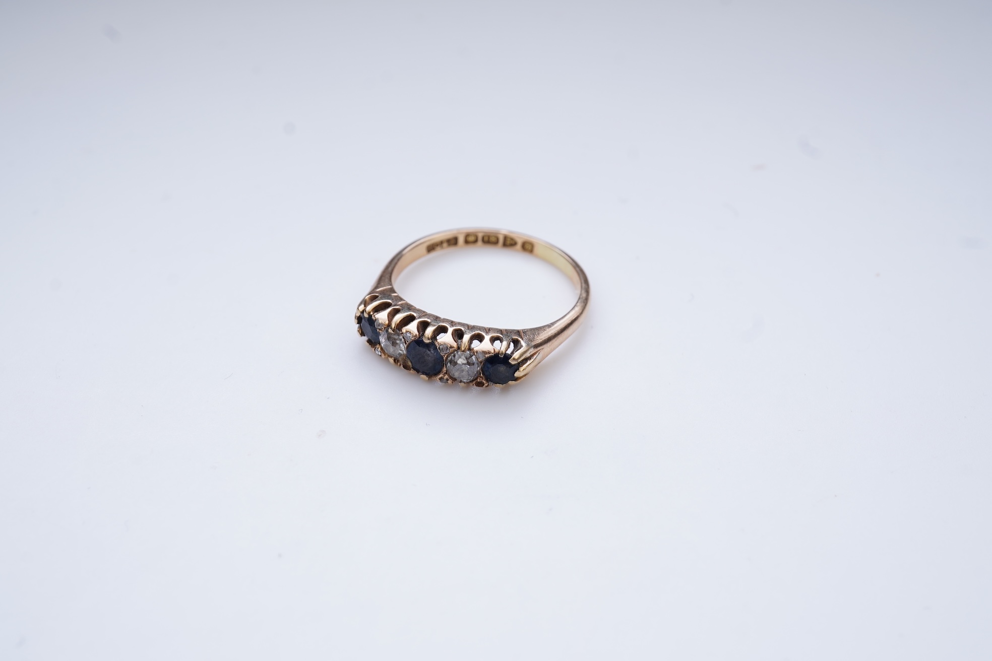 A sapphire and diamond five-stone ring, circa 1902
